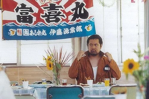 映画不灯港の小手伸也